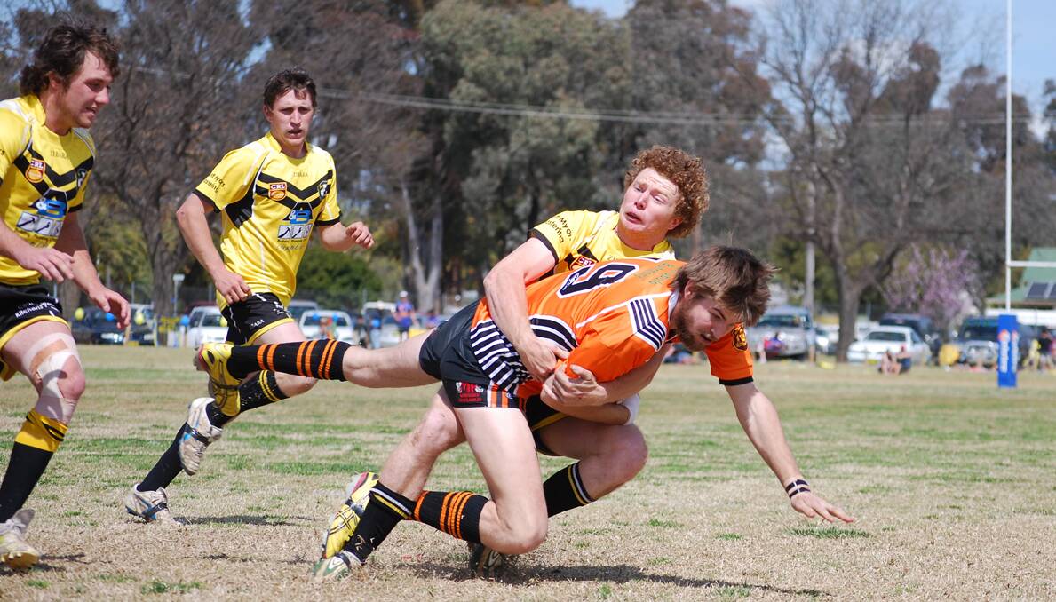 Eugowra under 18s player Matt Park tackles an opponent in Sunday's Youth League grand final, won by Canowindra.